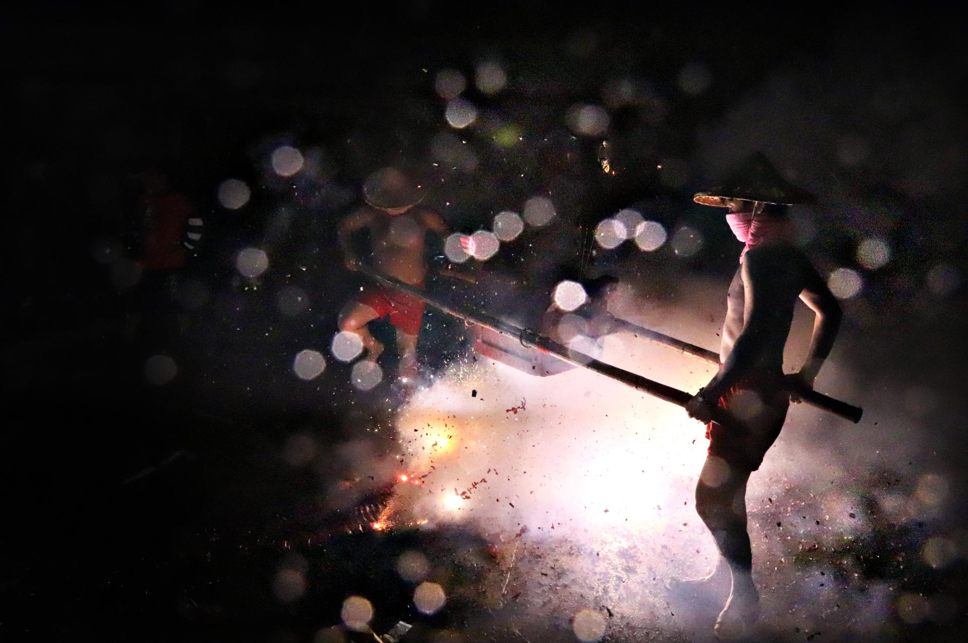 New York Photography Awards Winner -  The firecrackers praying to the Earth God