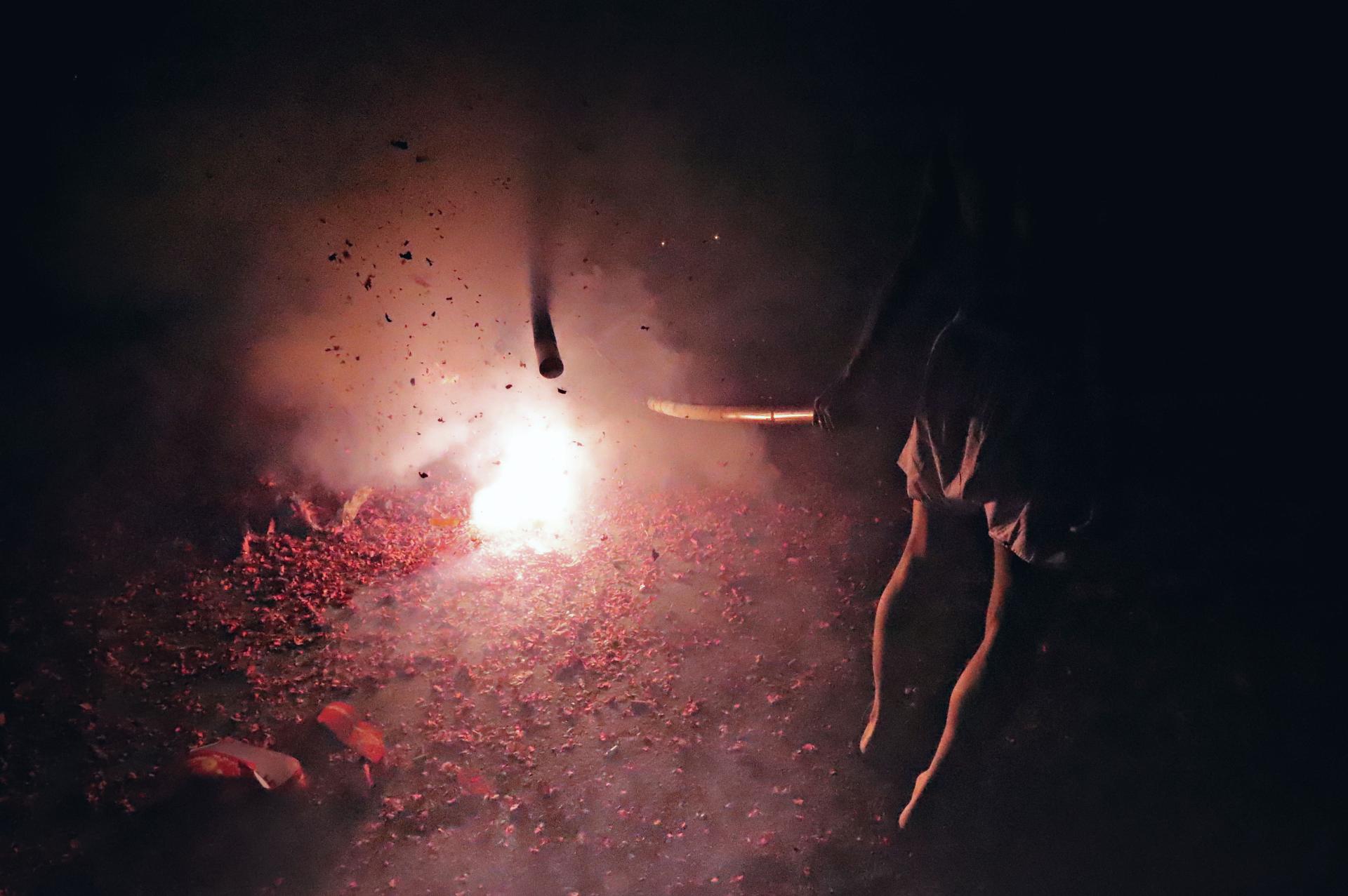 New York Photography Awards Winner -  The firecrackers praying to the Earth God