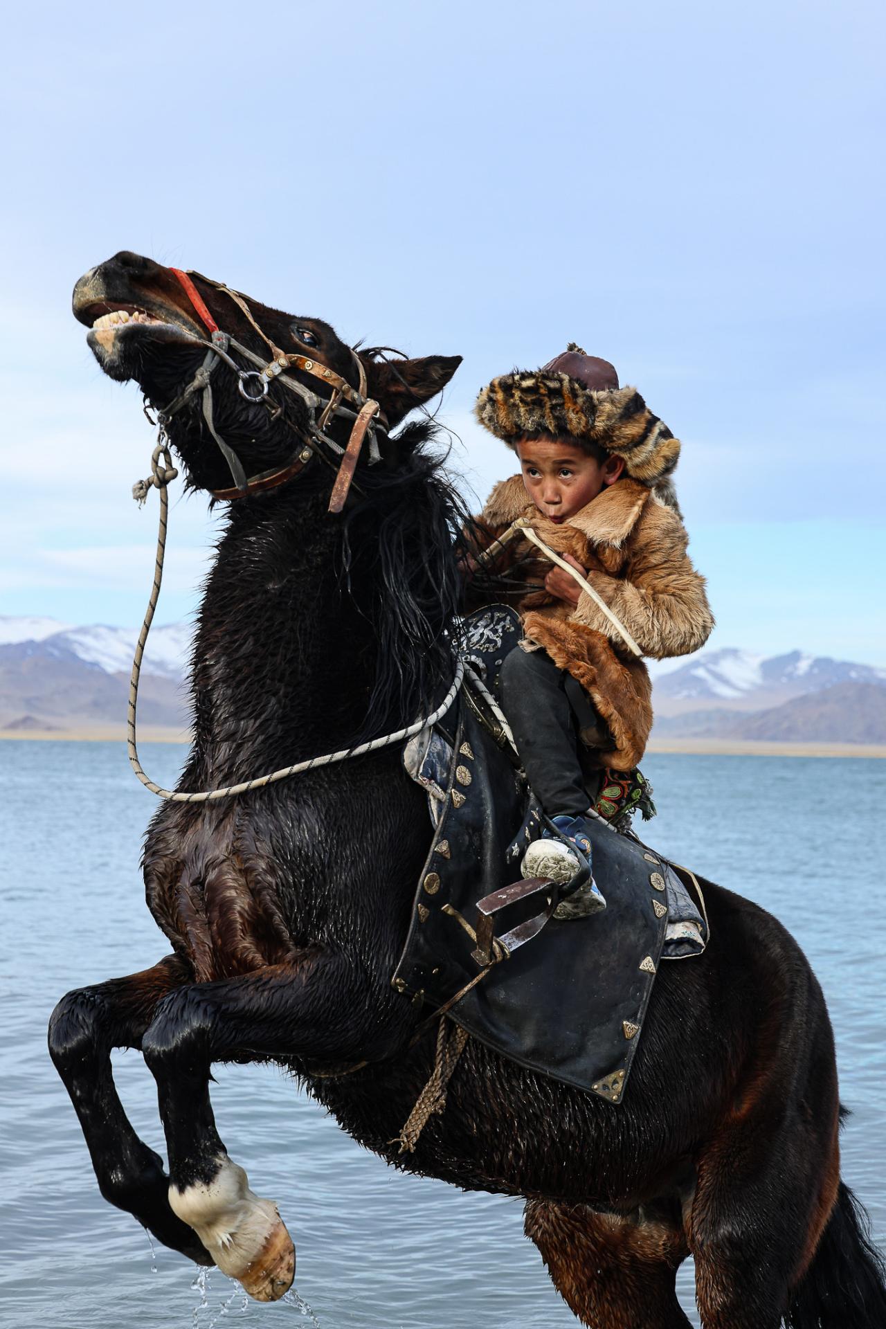 New York Photography Awards Winner - Young eagle hunter on horse